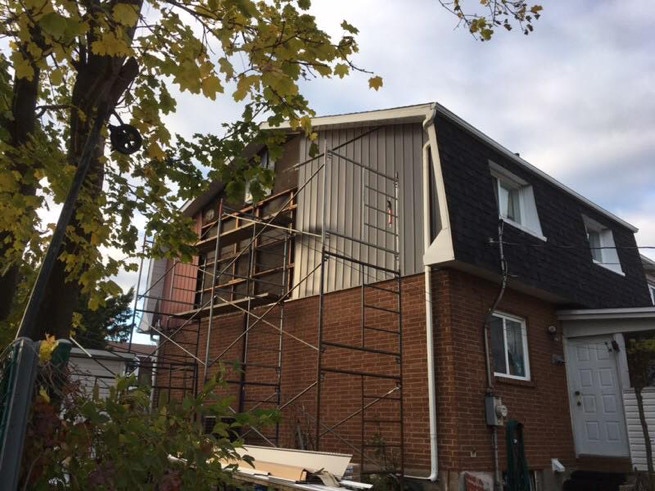 Renovation of siding with scaffolding.